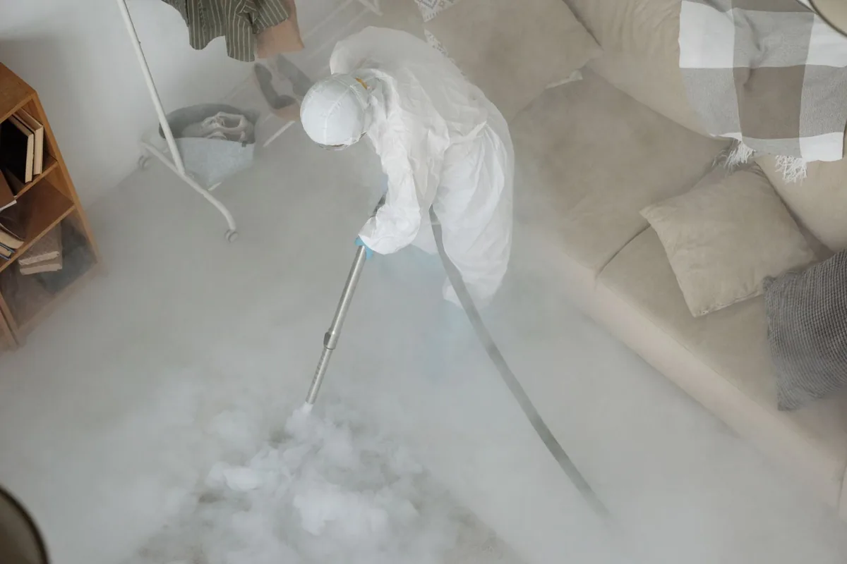 Biohazard cleanup technician in protective equipment, Omro, WI